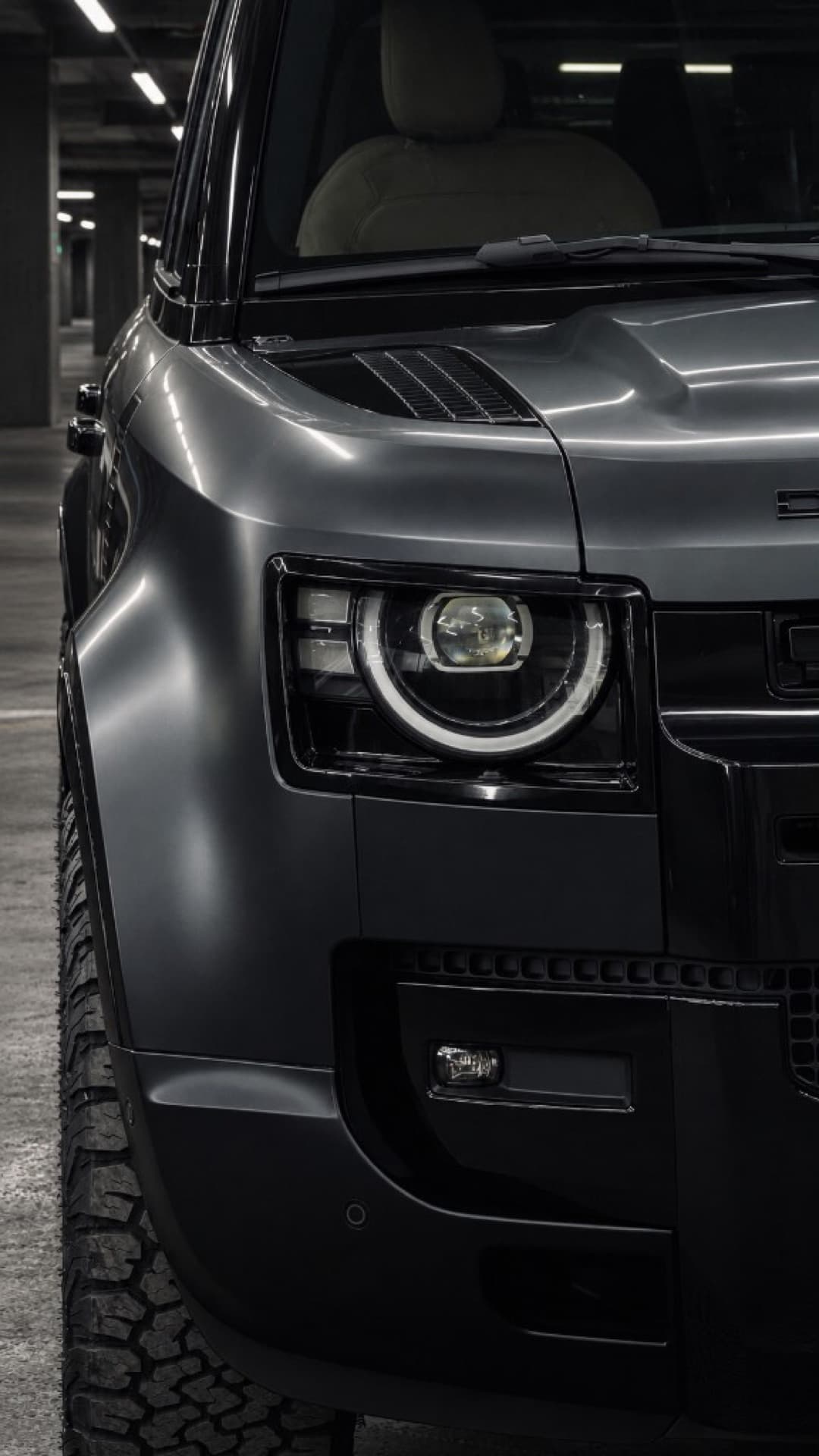 Headlight detail of a LuxCar Land Rover Defender