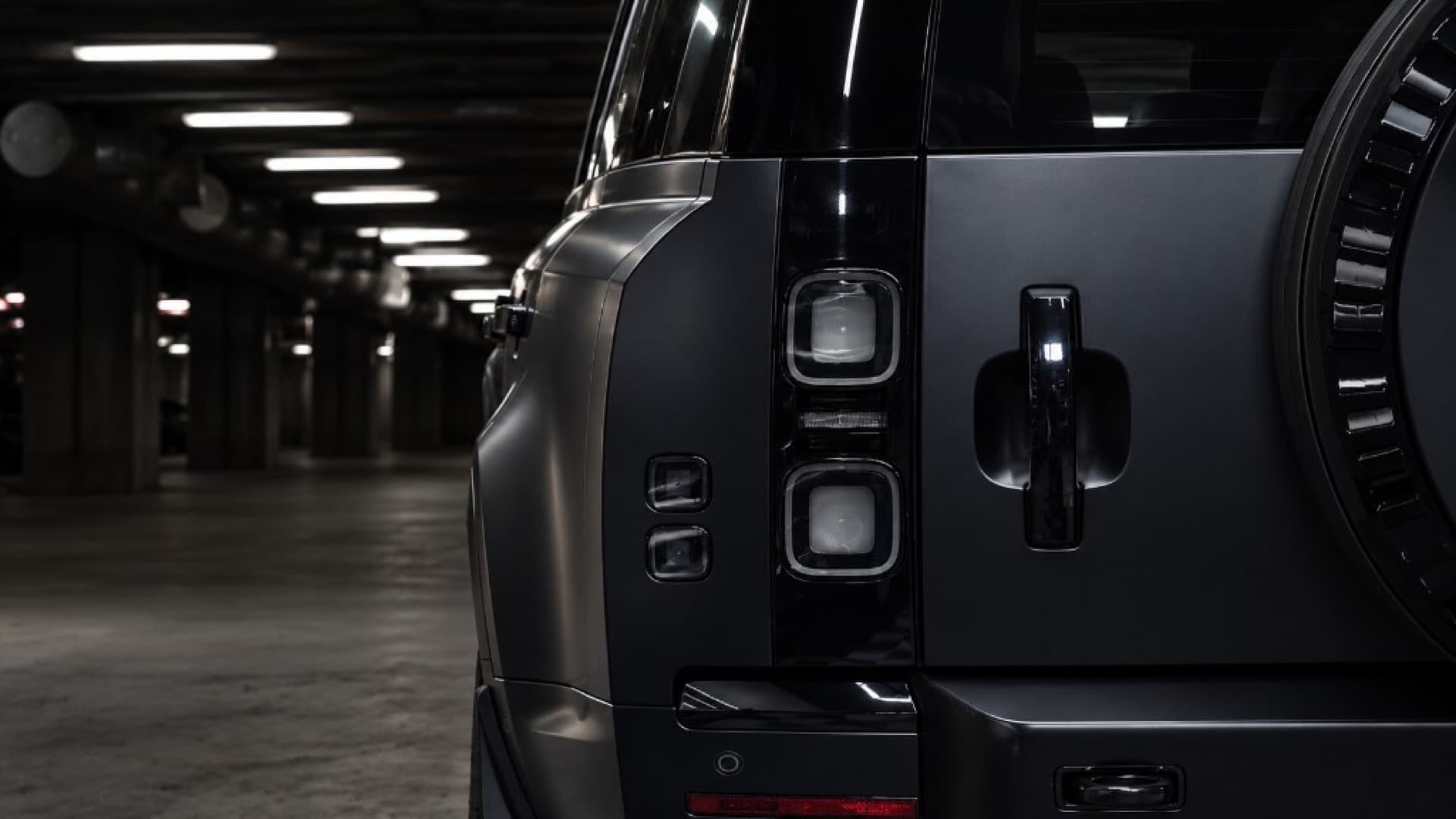 Rear detail of a LuxCar Land Rover Defender in the garage