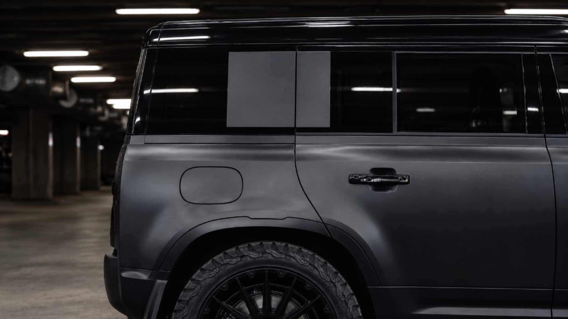 Side profile detail of a LuxCar Land Rover Defender